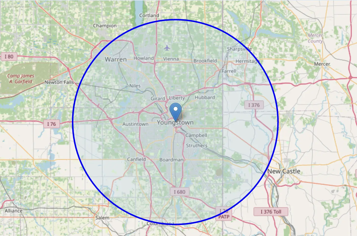 Map of the Youngstown area with a blue circle marking the service radius, covering Boardman, Austintown, Canfield, Kerman, Struthers, and more